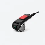 Angled view of a black car camera with a front lens, round side housing, red mounting pad and cable