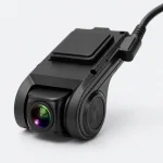 Close-up of the black car camera showing the front lens, side housing, top mount and cable connection