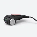 Low side view of the black car camera showing the lens, circular side housing and red mounting pad
