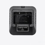 Empty black charging cradle with recessed battery slot and power indicator