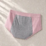 Pink brief laid on linen with its broad gray inner gusset visible