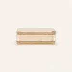 Closed cream jewelry case showing two gold-tone zipper tracks and stitched edges