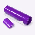 Purple gloss film roll lying beside a separate curved sample