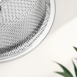Close-up of the basket’s wire mesh and rolled metal rim