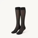 Pair of sheer black knee-high socks with solid cuffs, heels and toes