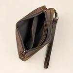 Open coffee leather clutch showing dark lining, an inner divider and card slots beside the wrist strap.
