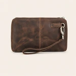 Straight-on rear view of the coffee leather clutch, with a centre seam and wrist strap across the lower edge.