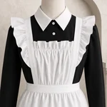 Mannequin close-up showing the white pointed collar, buttons and ruffled bib and shoulder straps of the white apron.