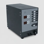 Angled view of the gray metal welder showing the left side, front panel and capped front connector