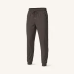 Front view of dark gray joggers with a drawstring waist, zip pockets and fitted cuffs