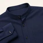 Primer plano de la camisa azul marino con cuello mao, botones delanteros, puño y bolsillo en el pecho