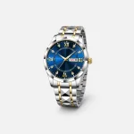 Blue-dial wristwatch standing upright with a silver-tone and gold-tone link bracelet.