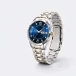 Angled view of a blue-dial watch showing its linked bracelet curved behind the case.