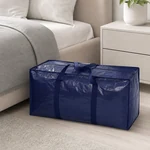Una bolsa azul cerrada junto a una cama como ejemplo de uso