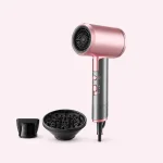 Pink hair dryer standing beside a black concentrator nozzle and diffuser.