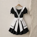 Rear view on a wooden hanger showing crossed ruffled apron straps, a large white bow and the apron’s double black trim.