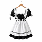Black dress and white apron on a wooden hanger against a white background, with a square ruffled neckline, puff sleeves and double black apron trim.