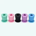 Green, pink, black, purple and blue scrap collectors arranged in a row