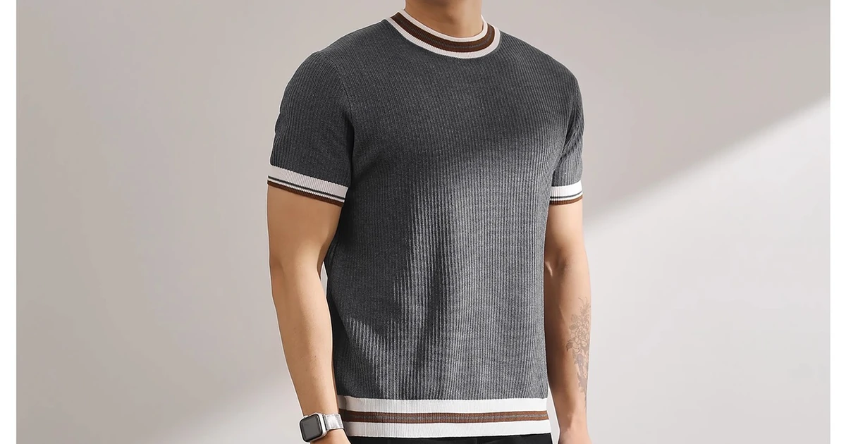 Gray crew-neck knit top worn with striped neckline, sleeve cuffs and lower hem visible.