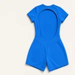 Blue romper laid flat with the oval back opening and shaped waist seams visible.