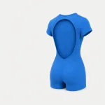 Rear angled view of a blue romper showing the open back and short legs.