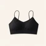 Front view of a black ribbed bralette with slim straps and a wide lower band