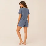 Rear view of a woman wearing a blue-gray speckled short-sleeve pajama set