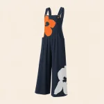 Marineblauer Jumpsuit mit weitem Bein, Trägern und großen orange-weißen Blumen