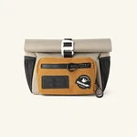 Front view of a khaki bike bag showing the rolled opening, orange zip pocket and black zipper pull