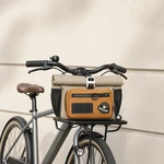 Khaki and orange bike bag shown at the front of a bicycle below the handlebars