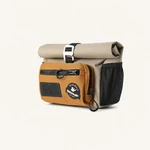 Angled view of a khaki bike bag with an orange front pocket and black mesh side pocket