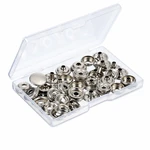 Open box of Silver metal snap parts on a light background.