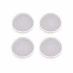 Four milky translucent round coaster molds arranged in two rows