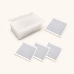 Rectangular holder mold shown with four square coaster molds on a light surface