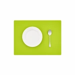 Green silicone placemat with a white plate and spoon on a table