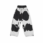 Black-and-white patterned wide-leg trousers laid flat