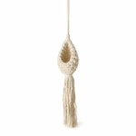 One beige cotton-rope macrame plant hanger with a woven basket and fringe on white.