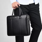 Person carrying the black briefcase by its two handles