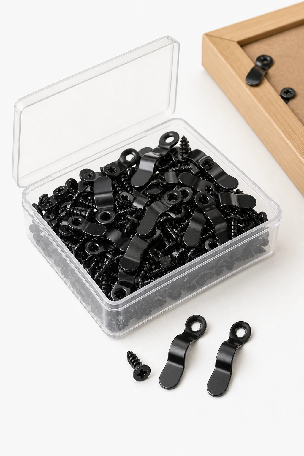 Box contents shown as black turn buttons and matching screws.