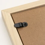 Turn button screwed to a wooden frame back with its tab over the backing panel.