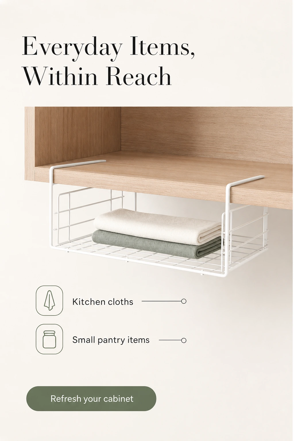 White under-shelf basket holding folded kitchen cloths