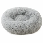 Couchage rond gris clair à poils longs avec bord surélevé et centre creux