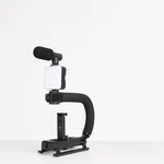Support noir pour smartphone sur fond clair, avec microphone et lumière rectangulaire au-dessus de la poignée