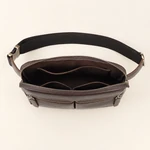Open waist bag showing interior sections and a zip pocket