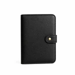 Closed black watch strap organizer with stitched edges and a small gold-tone snap on its tab