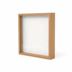 Empty natural-wood shadow box frame photographed from the front on a light background