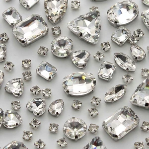 White option: clear glass stones with faceted surfaces and visible claw settings.