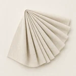 Beige linen couche fanned into several proofing folds