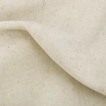 Close view of the beige linen weave and natural dark flecks